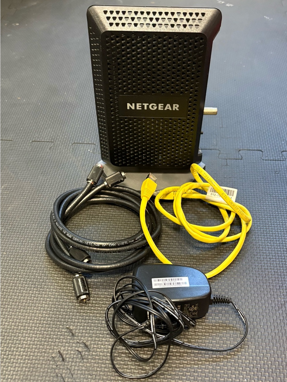 Netgear cable modem with cables and power cord